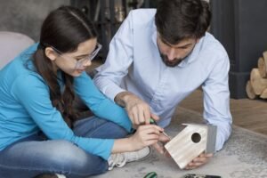 dad teaching girl build bird house 1 Ally Bohanan Real Estate | Luxury Real Estate in Gastonia, NC